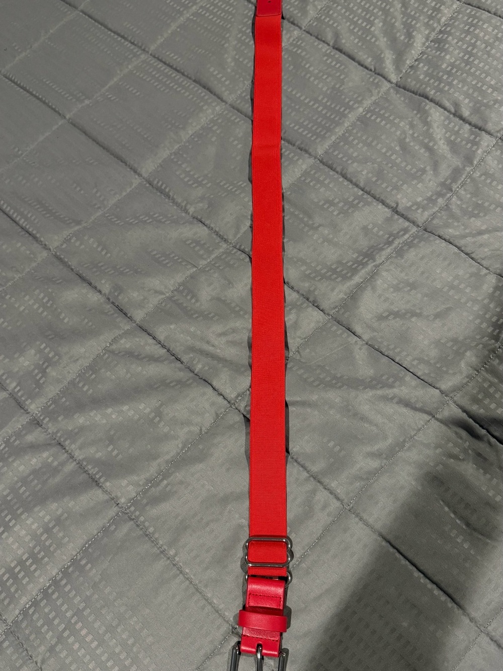 Under Armour Red Fabric Strap with Metal Hardware length 38” adjustable elastic